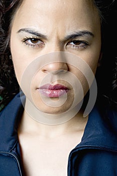 Young Latino woman angry