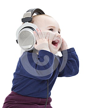 Young laughing child with ear-phones