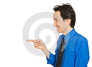 Young laughing handsome excited happy man pointing with finger