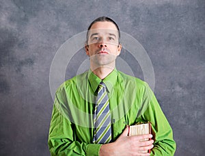 Young lawyer in green shirt with statute book