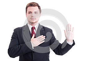 Young lawyer making oath or swearing gesture