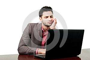 Young lawyer reading new laws on his laptop