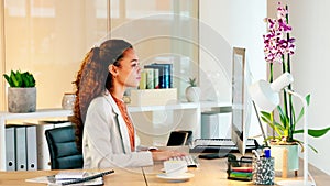 Young lawyer typing on a computer keyboard, planning defence and closing arguments for a paralegal court case. A