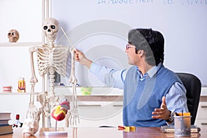 The young lecturer teacher teaching anatomy