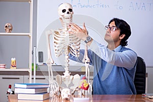 The young lecturer teacher teaching anatomy