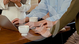 Young LGBTQ Asian Men and Woman Small Business Partner,Close-up of artisan`s hands placed on a desk and a laptop computer,