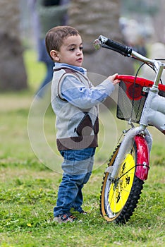 Young Little Boy with A Bike