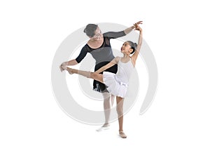 Young little girl ballerina learning dance lesson with ballet teacher