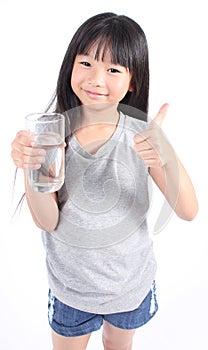 Young little girl drinking water.