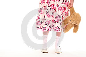 Young little girl holding teddy bear