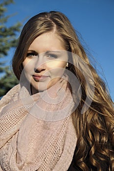 Young long-haired curly blonde woman