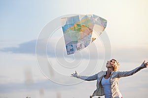 Young Lost Woman Losing a Map Because of the Wind