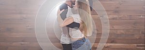 Young love couple dancing social danse kizomba or bachata over white background with copy space