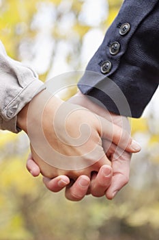 Young Love - Couple holding hands