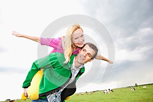 Young love Couple smiling under blue sky