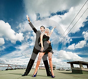 Young love Couple smiling under sky