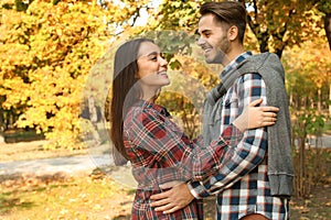 Young lovely couple spending time together in park