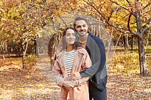 Young lovely couple spending time together in park