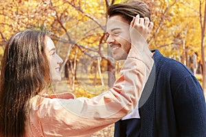 Young lovely couple spending time together in park