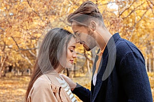 Young lovely couple spending time together in park