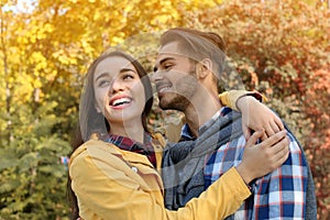 Young lovely couple spending time together in park