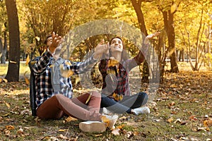 Young lovely couple spending time together in park