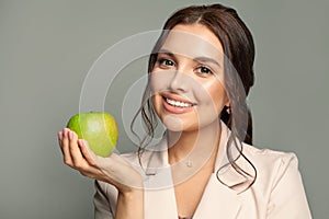 Young lovely woman with green apple portrait