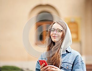 Young lovely woman with smartphone