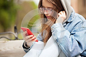 Young lovely woman with smartphone