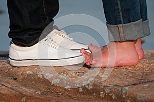 Young lovers on beautiful rock