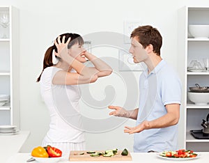 Young lovers having dispute in the kitchen