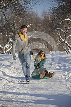 Young lovers having fun in winter clothes in the Park. Elegant w