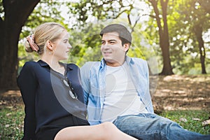 Young lovers say love in the park Romanticly. On a relaxing holiday