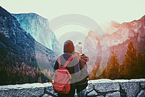 Young lovers standing together while enjoying famous Tunnel View