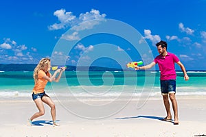 Young loving couple having fun on a tropical beach