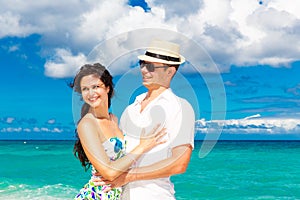 Young loving couple having fun in the tropical beach