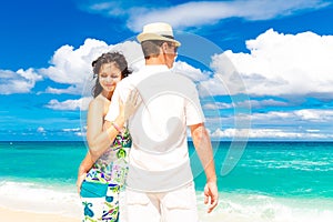 Young loving couple having fun in the tropical beach