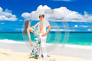 Young loving couple having fun in the tropical beach