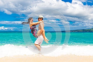 Young loving couple having fun in the tropical beach