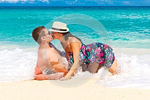 Young loving couple having fun in the tropical beach