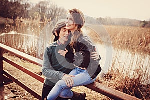 Young loving couple having fun on the walk in early spring