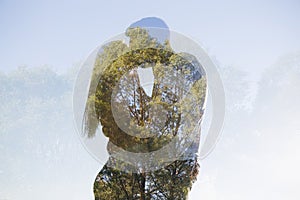 Young loving couple kissing against the sky