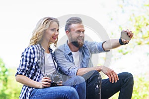 Young loving couple making selfie photo outdoor.