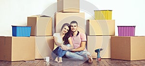 Young loving couple moving to a new house. Home and family concept.