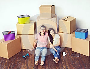 Young loving couple moving to a new house. Home and family concept.