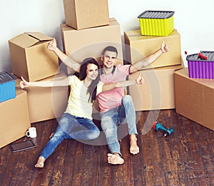 Young loving couple moving to a new house. Home and family concept.