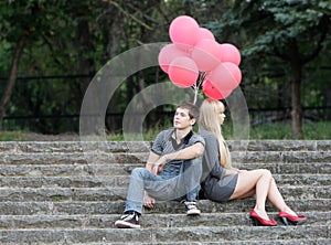 Young loving couple in park