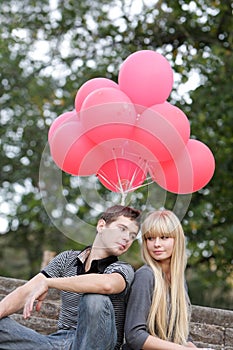 Young loving couple in park