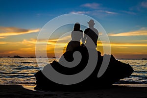 Young loving couple on wedding day on tropical beach and sunset