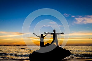 Young loving couple on wedding day on tropical beach and sunset